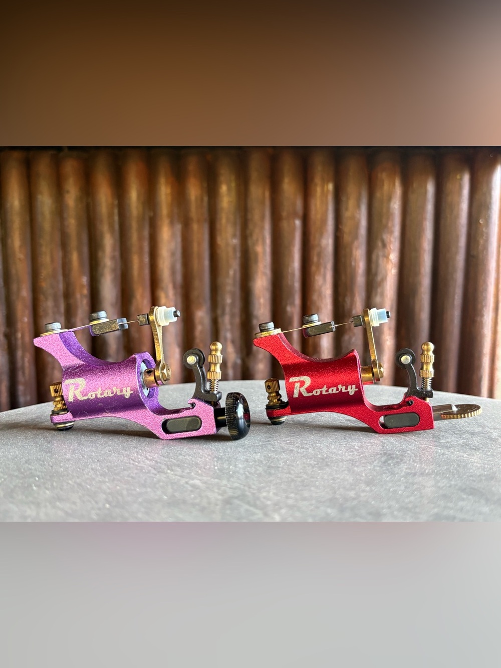 Two rotary Tattoo Machines purple and red